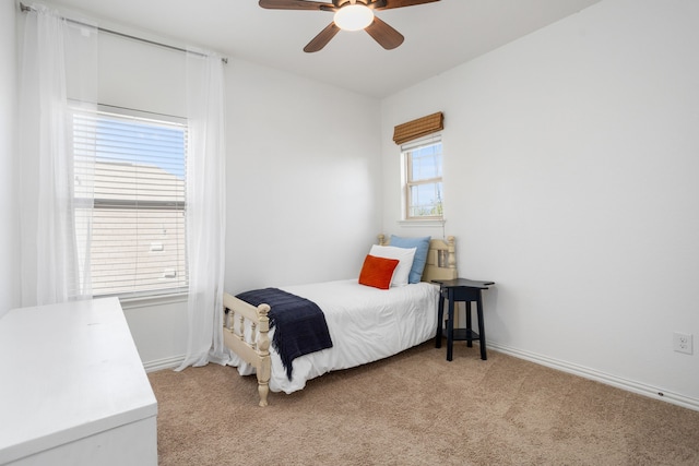 carpeted bedroom with ceiling fan