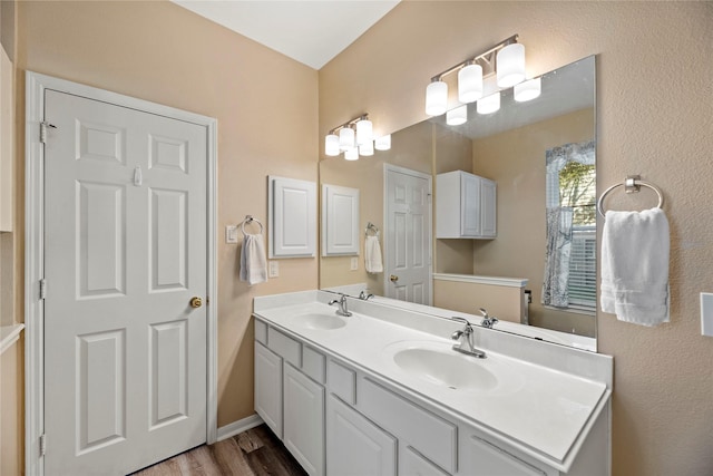 16507 Cypress Brook Ct, Cypress, TX 77429 - full bath with double vanity, wood finished floors, and baseboards