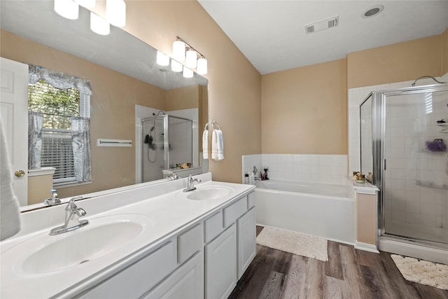 16507 Cypress Brook Ct, Cypress, TX 77429 - full bathroom featuring a stall shower, wood finished floors, a garden tub, and double vanity