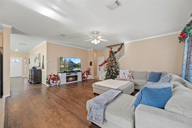 16507 Cypress Brook Ct, Cypress, TX 77429 - living room with wood finished floors, stairway, baseboards, crown molding, and a ceiling fan