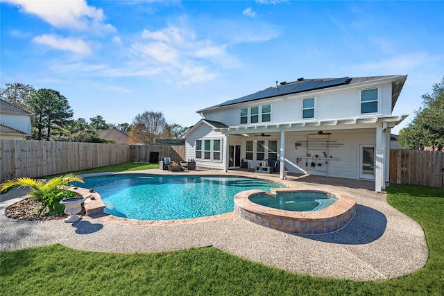 16507 Cypress Brook Ct, Cypress, TX 77429 - view of swimming pool with a ceiling fan, a fenced backyard, a patio, and a pool with connected hot tub