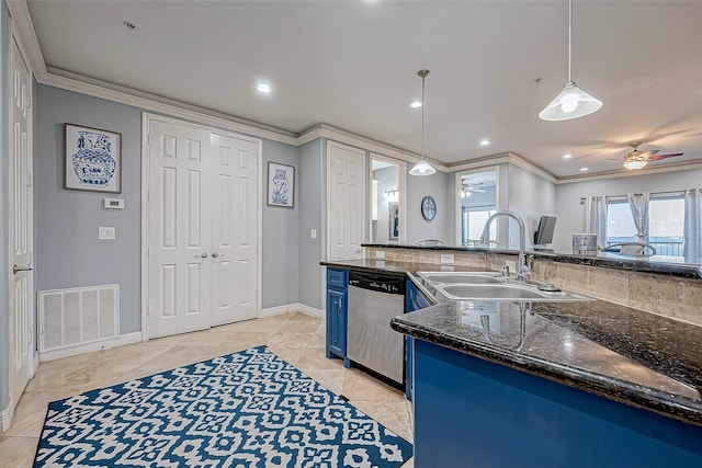 kitchen featuring dishwasher, blue cabinets, sink, decorative light fixtures, and light tile patterned flooring