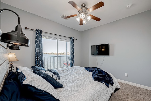 bedroom featuring access to outside, ceiling fan, and carpet floors