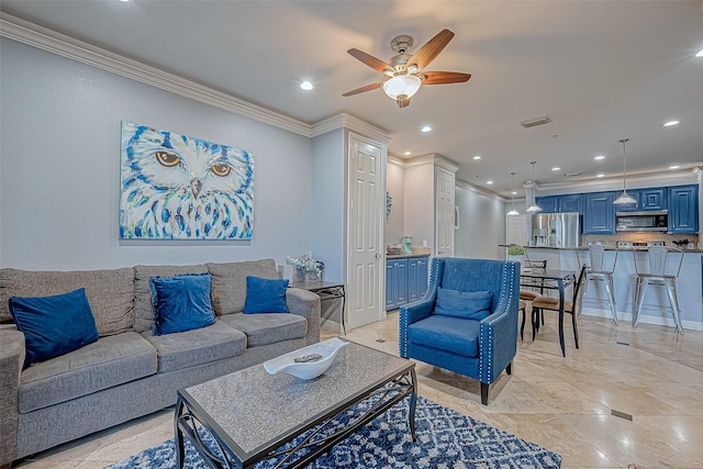 living room featuring ceiling fan and ornamental molding