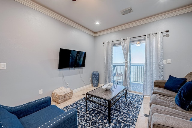 living room with light tile patterned floors and ornamental molding