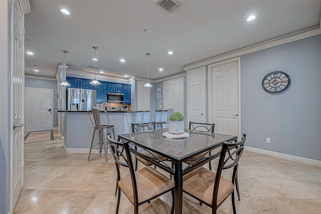 tiled dining room with crown molding