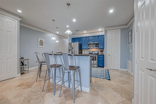 kitchen with blue cabinetry, tasteful backsplash, pendant lighting, a breakfast bar area, and appliances with stainless steel finishes