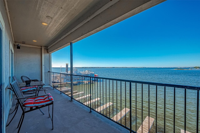 balcony featuring a water view