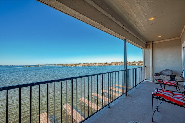 balcony featuring a water view