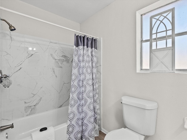 bathroom with toilet and shower / bathtub combination with curtain