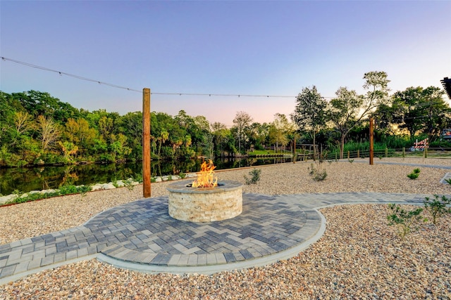 patio terrace at dusk with an outdoor fire pit