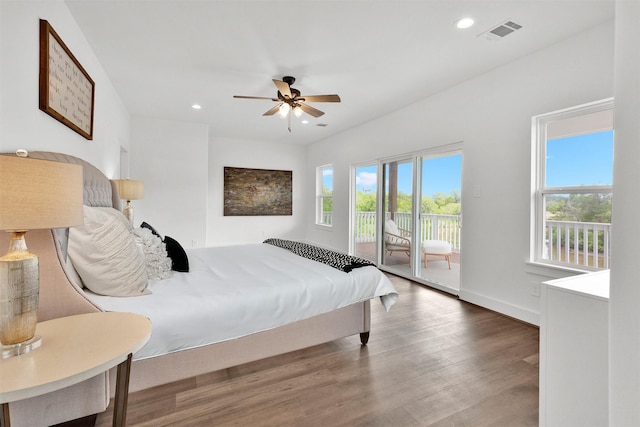 bedroom featuring hardwood / wood-style flooring, ceiling fan, and access to outside