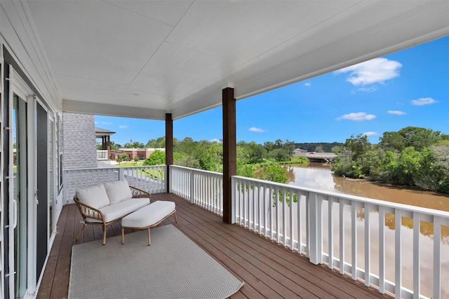 wooden terrace with a water view