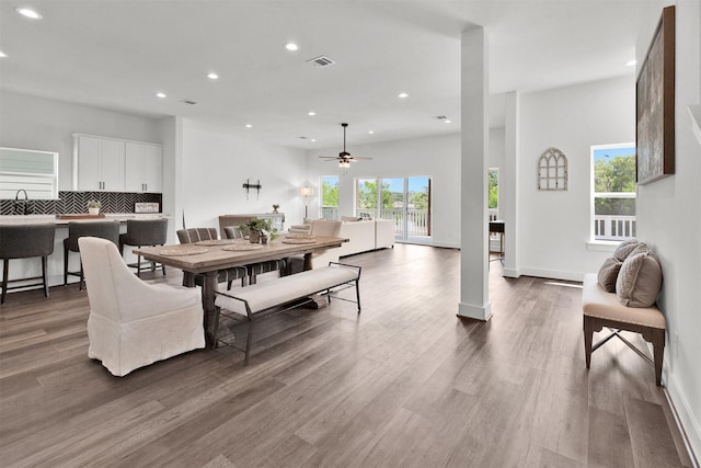 dining room featuring ceiling fan, hardwood / wood-style floors, and sink