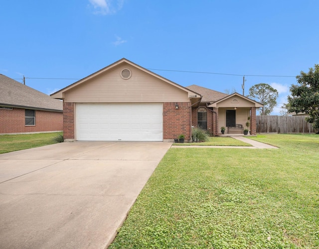 ranch-style house featuring a garage and a front lawn