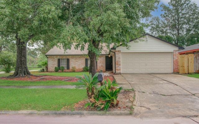 view of front of property featuring a front lawn and a garage