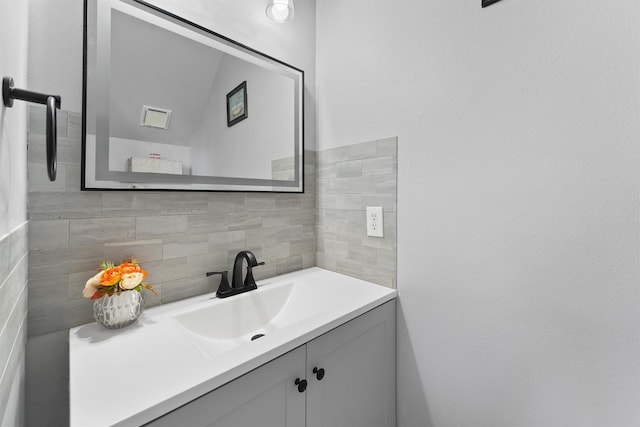 bathroom with backsplash and vanity