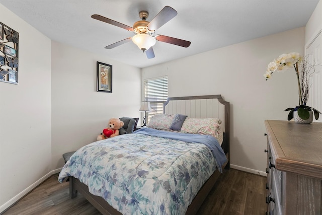 bedroom featuring ceiling fan and dark hardwood / wood-style flooring