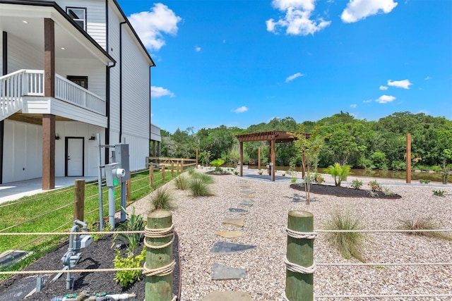 view of yard with a pergola and a balcony