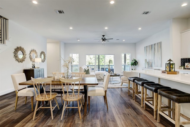 dining area with dark hardwood / wood-style floors and ceiling fan