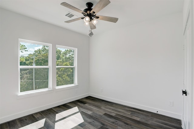 unfurnished room featuring ceiling fan and dark wood-type flooring