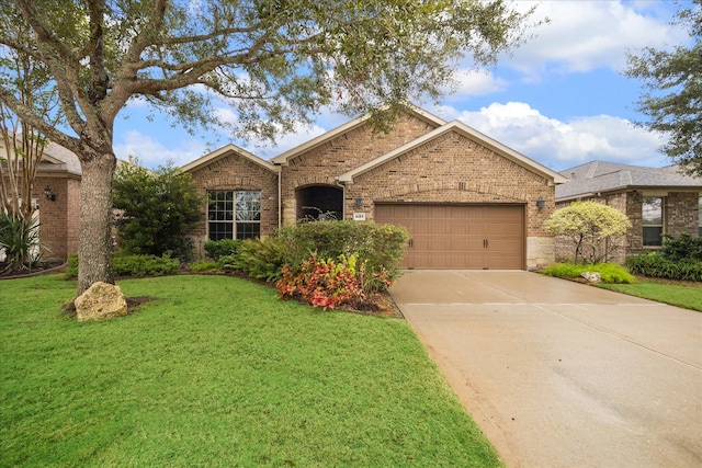 single story home featuring a front yard and a garage