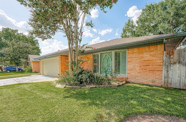 ranch-style home with a front yard and a garage