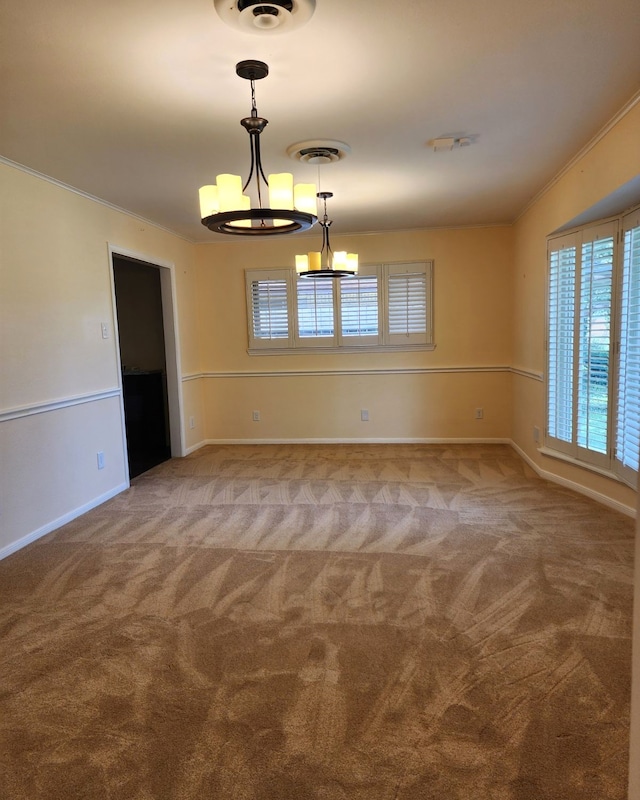 carpeted spare room with crown molding