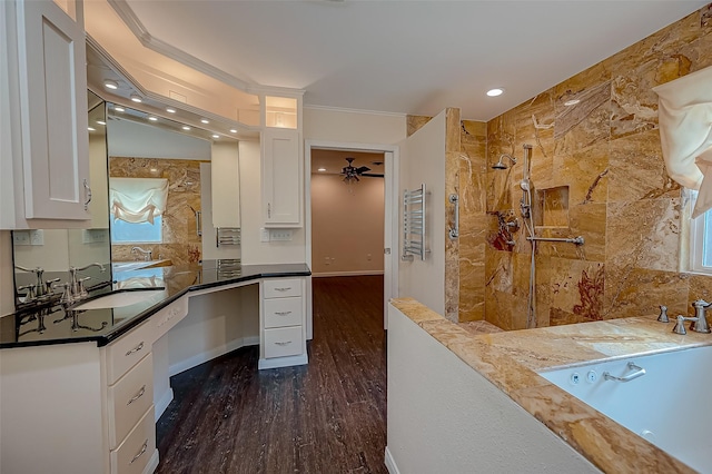 interior space with white cabinets, sink, ceiling fan, ornamental molding, and dark hardwood / wood-style flooring