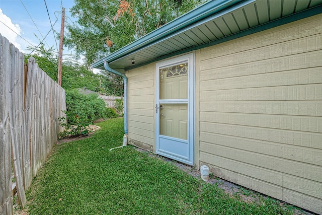 view of outbuilding featuring a lawn