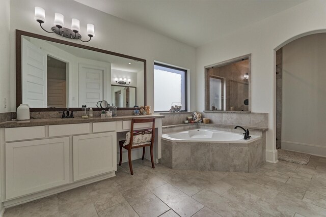 bathroom with plus walk in shower and vanity