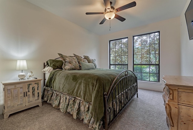 bedroom featuring ceiling fan and light colored carpet