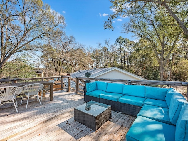 wooden terrace featuring outdoor dining area and outdoor lounge area