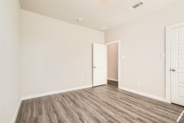 empty room with light hardwood / wood-style flooring