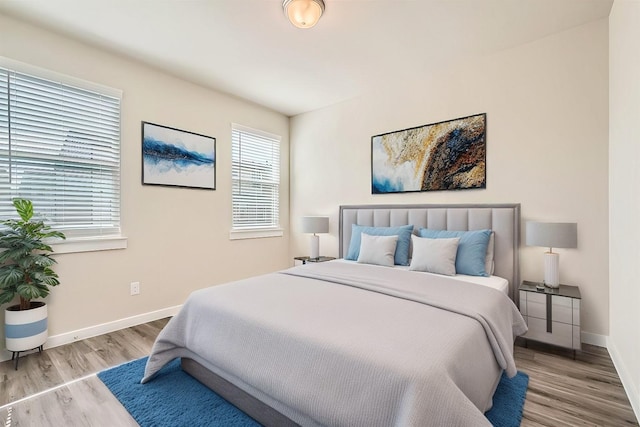 bedroom with light wood-type flooring