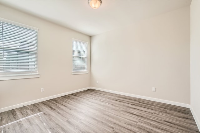 unfurnished room featuring hardwood / wood-style floors