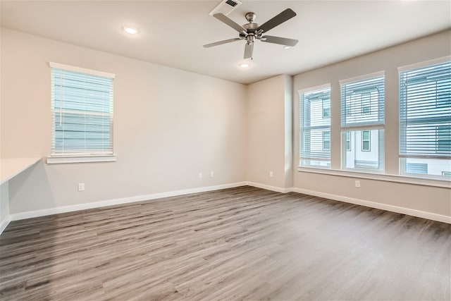 unfurnished room featuring ceiling fan and hardwood / wood-style flooring