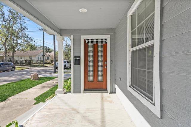 doorway to property featuring a porch