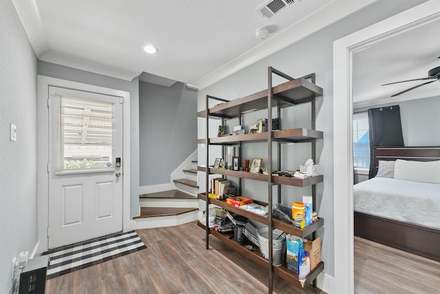 interior space with ceiling fan