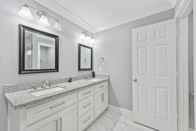 bathroom with vanity and crown molding