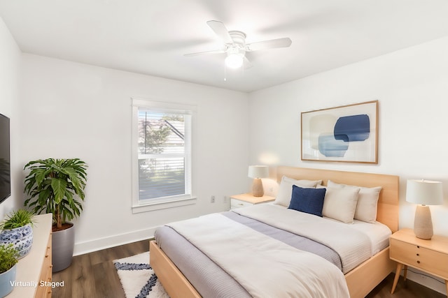 bedroom featuring dark hardwood / wood-style flooring and ceiling fan