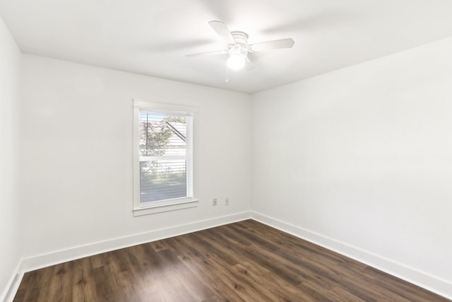 spare room featuring dark hardwood / wood-style floors and ceiling fan