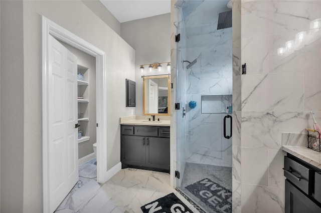 bathroom with vanity, toilet, and walk in shower