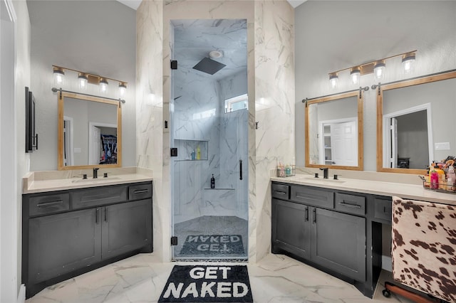 bathroom featuring an enclosed shower and vanity