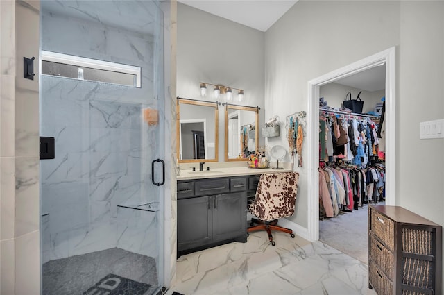 bathroom featuring vanity and an enclosed shower