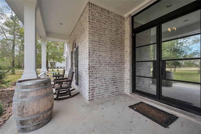 view of patio featuring french doors and covered porch