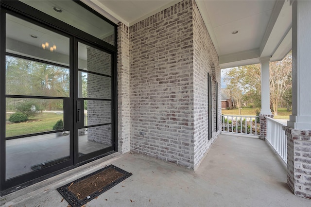 property entrance with covered porch