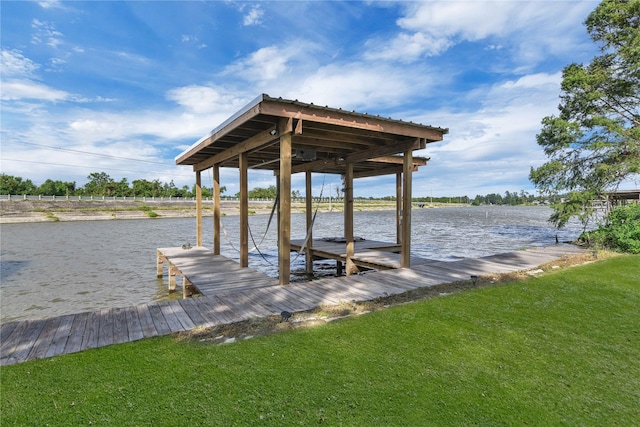 dock area featuring a yard and a water view