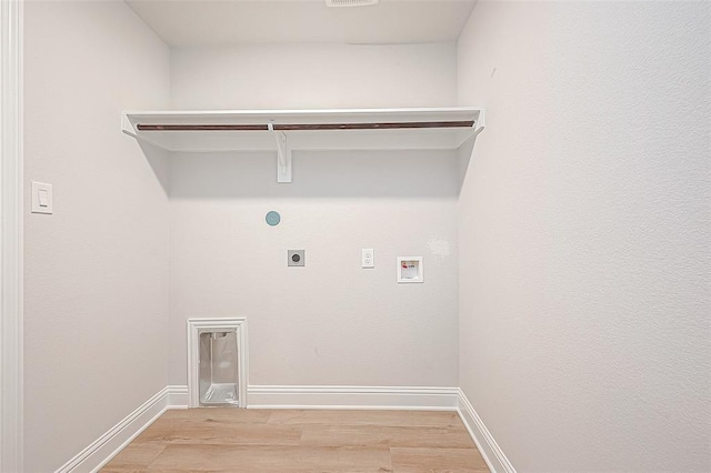 laundry area featuring washer hookup, electric dryer hookup, and light wood-type flooring