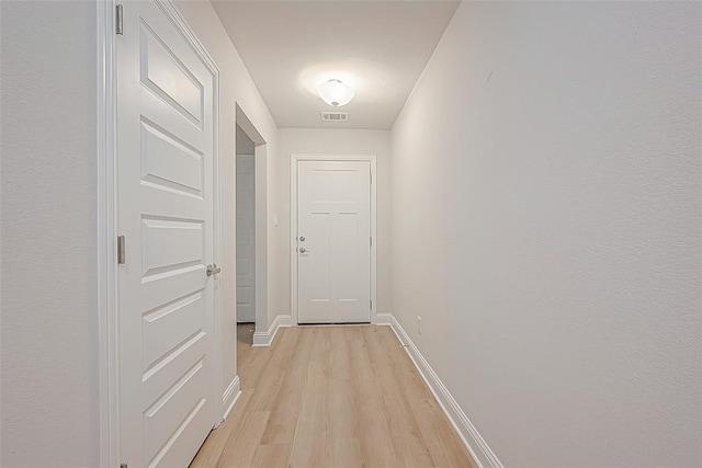 hallway featuring light hardwood / wood-style flooring